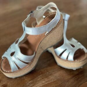 Brand new silver sandals purchased in Porto, Portugal.